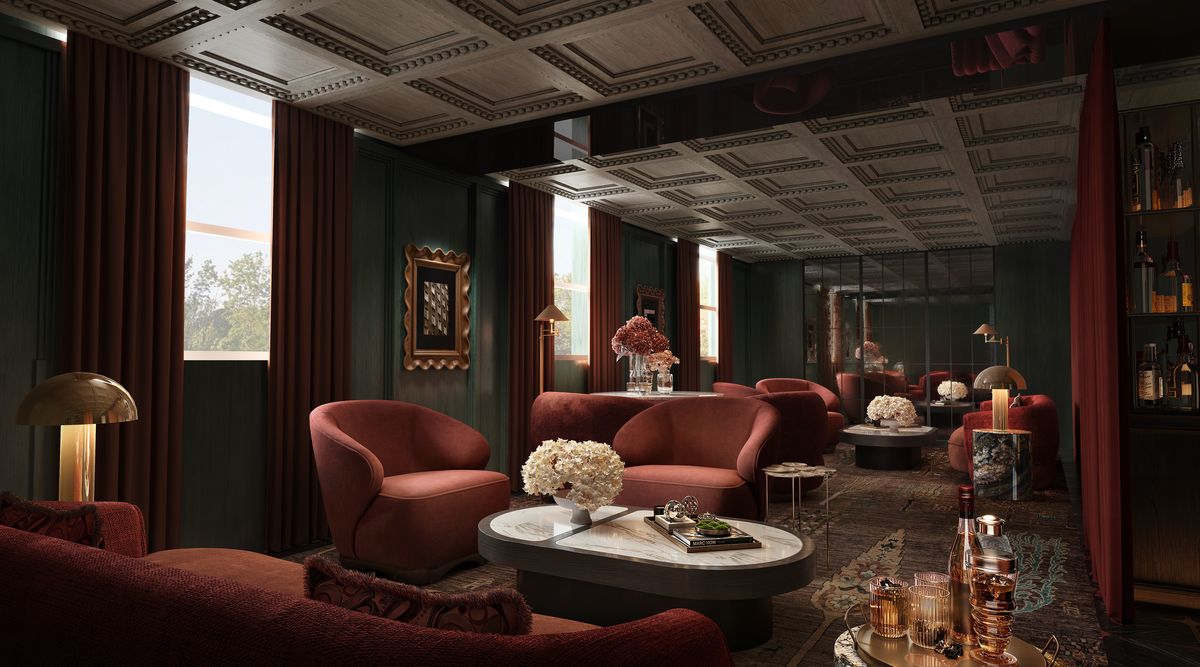 A VANTA lounge with deep red velvet armchairs and warm lamplight