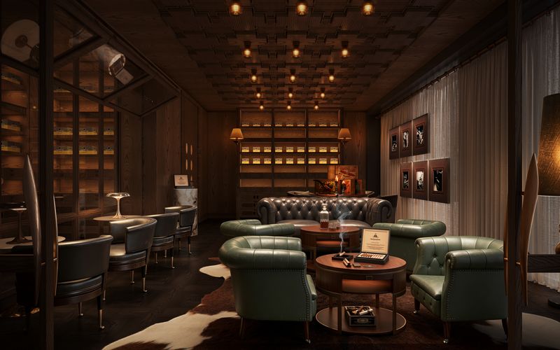The cigar lounge at VANTA, green leather chesterfields beneath a coffered ceiling