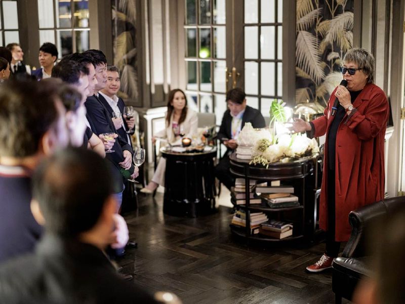 A chef speaking to guests during an intimate VANTA dinner