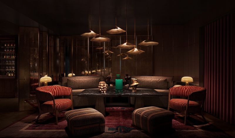 The VIP room at VANTA in deep amber light, with sculptural pendant lamps and velvet armchairs